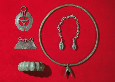 Semi-Circular Razor, Straight-Edged Razor, Bracelet with Egg-Shaped Design, Torque with Pendant and a Chain with Two Pendants, 750-475 BC by Gaulish